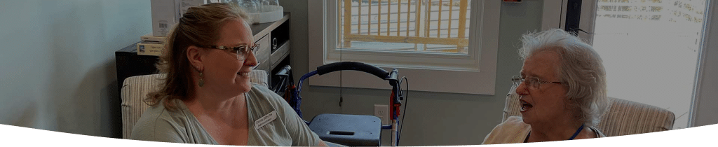 Candy helping assisted living resident
